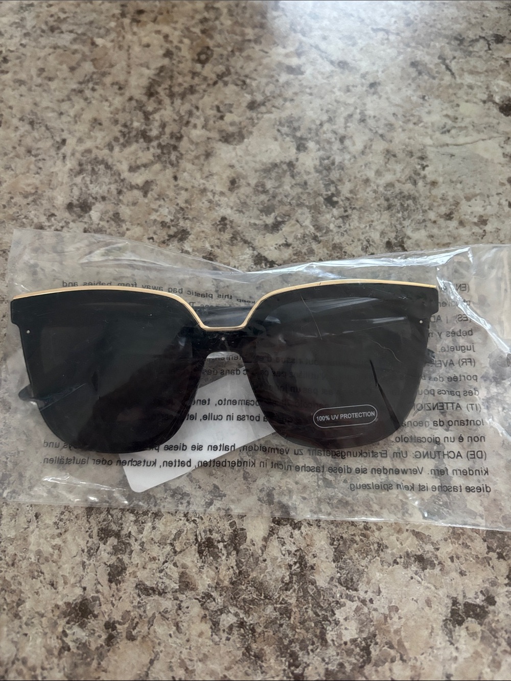 Women’s Black Cat-Eye Sunglasses with Gold Trim